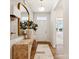 Inviting entryway featuring wood floors, stylish console table, and view of the outdoors at 1070 Bull Dog Ln, Wingate, NC 28174