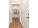 The hallway leads to a bright storage area, complemented by wooden floors at 1070 Bull Dog Ln, Wingate, NC 28174