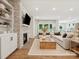 Open-concept living room with fireplace, a kitchen and hardwood floors creates a warm, inviting atmosphere at 1070 Bull Dog Ln, Wingate, NC 28174
