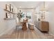 Bright office features a round table, cushioned ottomans, and chic decor, creating a stylish workspace at 1070 Bull Dog Ln, Wingate, NC 28174