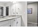 Elegant bathroom featuring double vanity with granite countertop and modern fixtures at 109 Trent Pines Dr, Mooresville, NC 28117
