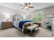 Charming bedroom featuring a plush bed, window views, and stylish decor at 109 Trent Pines Dr, Mooresville, NC 28117