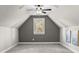 Bonus room featuring neutral carpet, gray accent wall and a ceiling fan at 109 Trent Pines Dr, Mooresville, NC 28117