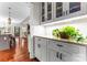 Convenient butler's pantry with granite countertops, glass-front cabinets and ample storage at 109 Trent Pines Dr, Mooresville, NC 28117