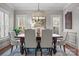 Formal dining room with elegant decor, statement lighting, and stylish furniture at 109 Trent Pines Dr, Mooresville, NC 28117