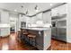 Modern kitchen with stainless steel appliances, granite countertops, and island seating at 109 Trent Pines Dr, Mooresville, NC 28117