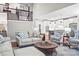 Open concept living area flowing into a modern kitchen with staircase at 109 Trent Pines Dr, Mooresville, NC 28117
