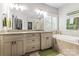 Luxurious main bathroom with a double vanity, soaking tub, and separate shower at 109 Trent Pines Dr, Mooresville, NC 28117