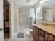 Updated bathroom featuring a shower and tub combination, modern fixtures, and granite countertop vanity at 1210 Tabitha Ct, Monroe, NC 28110