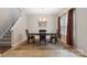 Elegant dining area with stylish table, chairs, and natural light from the nearby window at 1210 Tabitha Ct, Monroe, NC 28110