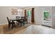Cozy dining area with dark wood table, chairs, and a view of the outdoor patio at 1210 Tabitha Ct, Monroe, NC 28110
