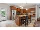 Kitchen featuring granite countertops, stainless steel appliances, tile floors, and a center island at 1210 Tabitha Ct, Monroe, NC 28110