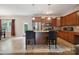 Open kitchen with granite countertops, stainless steel appliances, tile floors, and a kitchen island at 1210 Tabitha Ct, Monroe, NC 28110
