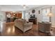 Inviting living room featuring hardwood floors and opening to a well-appointed kitchen at 1210 Tabitha Ct, Monroe, NC 28110