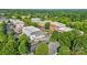 Aerial view showcasing a commercial district with brick buildings, green trees, and convenient parking at 126 Blandina Ct, Fort Mill, SC 29708