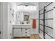 Modern bathroom with white vanity, black accents, updated lighting, and walk-in shower at 126 Blandina Ct, Fort Mill, SC 29708
