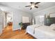 Cozy bedroom with hardwood floors, neutral paint, and access to ensuite bathroom and living area at 126 Blandina Ct, Fort Mill, SC 29708