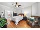 Bright bedroom boasts hardwood floors, ceiling fan, ensuite bathroom, and ample closet space at 126 Blandina Ct, Fort Mill, SC 29708