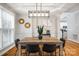 Dining area showcasing a wooden table, stylish decor, and modern lighting fixture at 126 Blandina Ct, Fort Mill, SC 29708