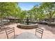 Community fountain surrounded by mature trees, tables, chairs, and attractive brickwork at 126 Blandina Ct, Fort Mill, SC 29708