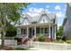 Charming two-story home with a welcoming front porch, a white picket fence, and neatly landscaped yard at 126 Blandina Ct, Fort Mill, SC 29708