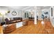 Open-concept living room and dining area with hardwood floors and stylish furniture at 126 Blandina Ct, Fort Mill, SC 29708