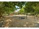 Community playground featuring swings, a slide, and mature trees providing shade at 126 Blandina Ct, Fort Mill, SC 29708