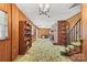 Finished basement featuring a brick fireplace, wood paneled walls, and carpet at 128 Howie St, Mount Holly, NC 28120