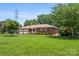 Attractive brick home with manicured front lawn and two-car garage at 128 Howie St, Mount Holly, NC 28120