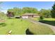 A well-maintained front yard with a charming house and lush green grass at 128 Howie St, Mount Holly, NC 28120