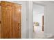 Inviting hallway with a decorative door and a glimpse into the living room at 128 Howie St, Mount Holly, NC 28120