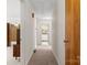 Hallway with a neutral carpet, and wood doors on both sides, with access to other rooms at 128 Howie St, Mount Holly, NC 28120