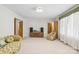 Spacious living room featuring carpet, furniture, and abundant natural light at 128 Howie St, Mount Holly, NC 28120