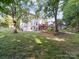 Spacious backyard featuring a deck, patio, and grassy area at 130 Nims Spring Dr, Fort Mill, SC 29715