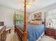 Bedroom with four-poster bed, ceiling fan, and matching end tables at 130 Nims Spring Dr, Fort Mill, SC 29715