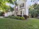 Traditional two-story home with beautiful lawn, red shutters, and front door wreath at 130 Nims Spring Dr, Fort Mill, SC 29715