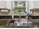 Kitchen sink with granite counter tops and nice size window at 130 Nims Spring Dr, Fort Mill, SC 29715