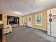 Cozy living room with a neutral color palette, multiple windows, and an open doorway to other rooms at 130 Nims Spring Dr, Fort Mill, SC 29715