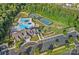Aerial view of community clubhouse with pool, tennis courts, playground, and parking at 1335 Bryson Gap Dr, Fort Mill, SC 29715