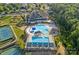 Aerial view of community pool with slides, swimming lanes, and tennis courts at 1335 Bryson Gap Dr, Fort Mill, SC 29715