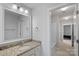 Neutral bathroom with granite counters, large mirror, and shower-tub combination at 1335 Bryson Gap Dr, Fort Mill, SC 29715