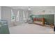 Bright Bedroom with a cute animal mural, crib, comfortable chair, and neutral carpet at 1335 Bryson Gap Dr, Fort Mill, SC 29715