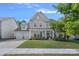 Charming two-story home featuring a two-car garage and landscaped front yard at 1335 Bryson Gap Dr, Fort Mill, SC 29715