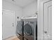 Convenient laundry room with modern washer and dryer units, enhancing ease of living at 1335 Bryson Gap Dr, Fort Mill, SC 29715