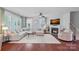 Spacious living room features large windows and a cozy fireplace at 1335 Bryson Gap Dr, Fort Mill, SC 29715