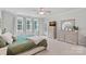 Light-filled main bedroom includes a ceiling fan and dresser, creating a peaceful retreat at 1335 Bryson Gap Dr, Fort Mill, SC 29715
