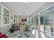 Inviting sunroom with ample light, tiled floor, and direct access to the patio at 1335 Bryson Gap Dr, Fort Mill, SC 29715