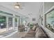 Bright sunroom featuring large windows, tile floors, and comfortable seating at 1335 Bryson Gap Dr, Fort Mill, SC 29715