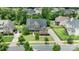 Sprawling home with well-maintained lawn, long driveway, mature trees, and neighborhood view at 13519 Crystal Springs Dr # 148, Huntersville, NC 28078