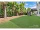 The backyard features a grassy lawn and a deck with stairs at 13519 Crystal Springs Dr # 148, Huntersville, NC 28078